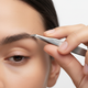 Tweezerman Stainless Steel Slant Tweezer - In Hand Lifestyle